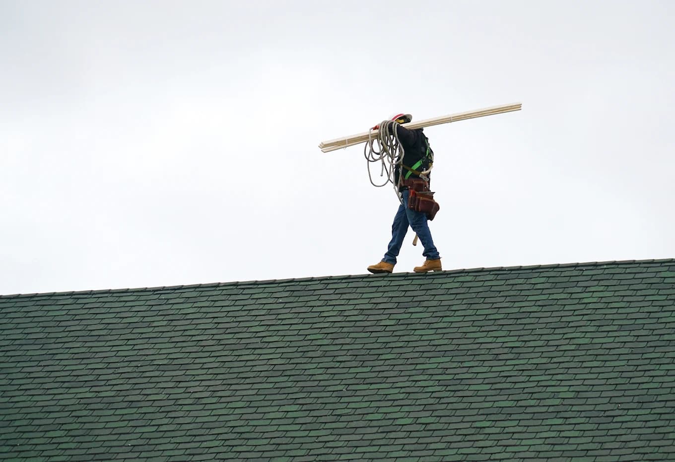 A Heritage Contractors crew installing a new roof