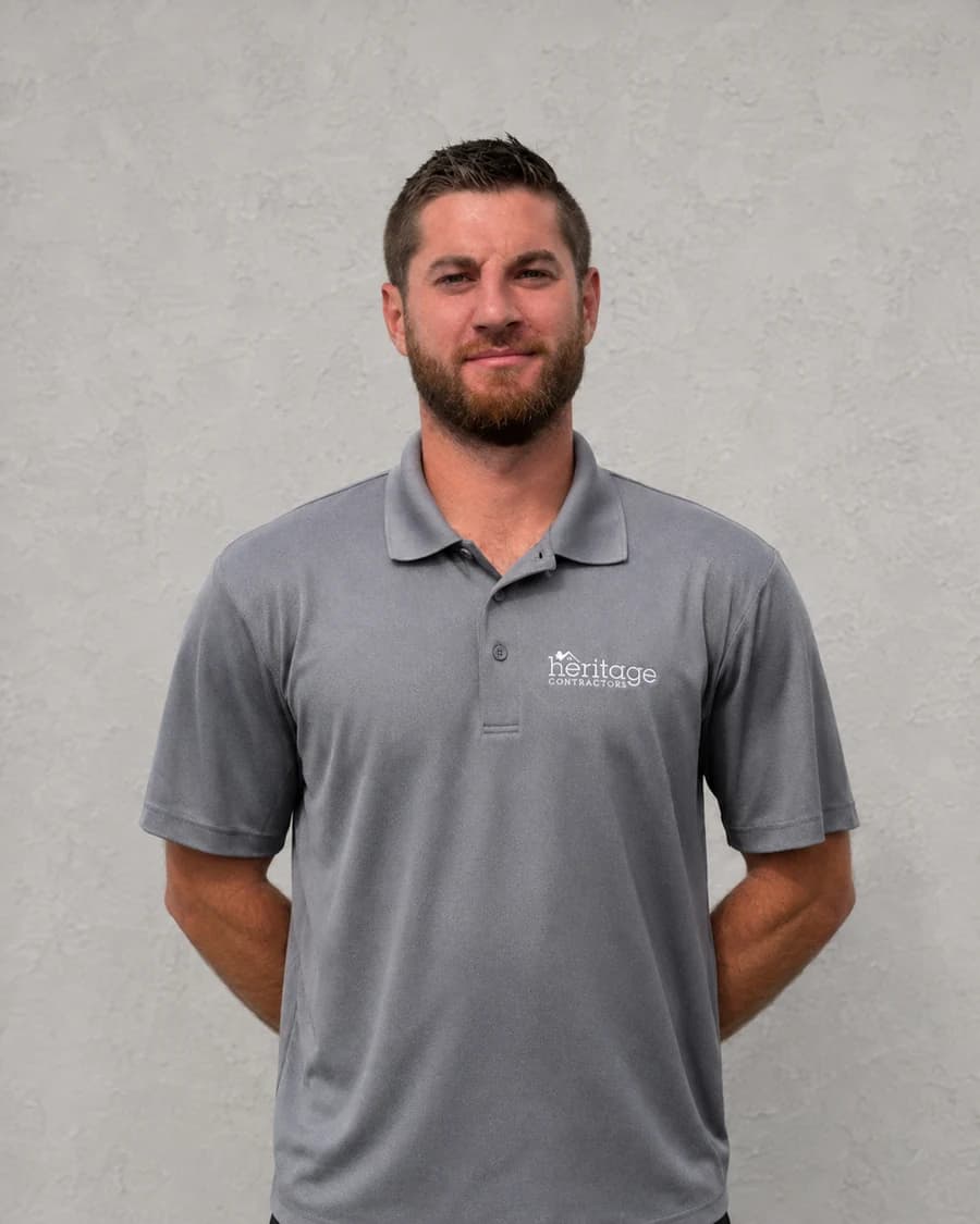 Matt C., Project Manager at Heritage Contractors, in a gray polo shirt
